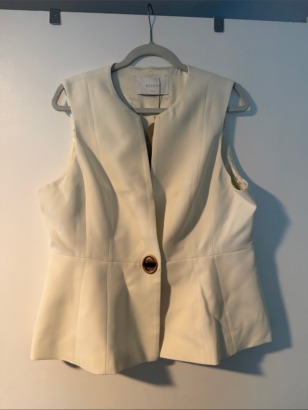 Meshki Cream Sleeveless Peplum Vest with Gold Button Detail